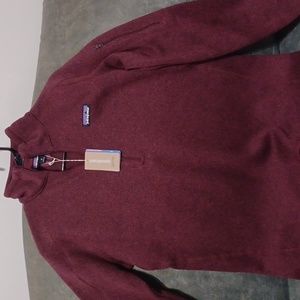 A brand new women's Patagonia sweater with 1/4 zipper.